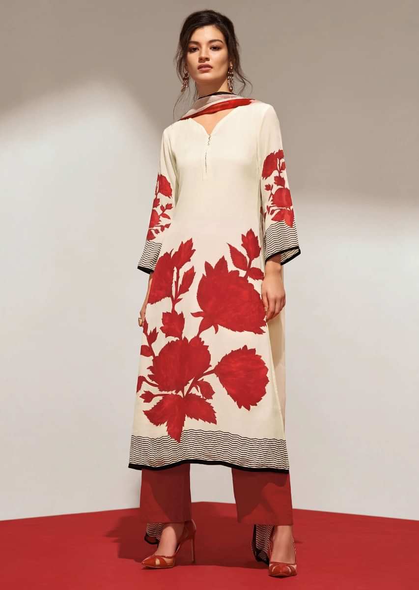 Cream unstithced suit with maroon floral print all overonly on Kalki