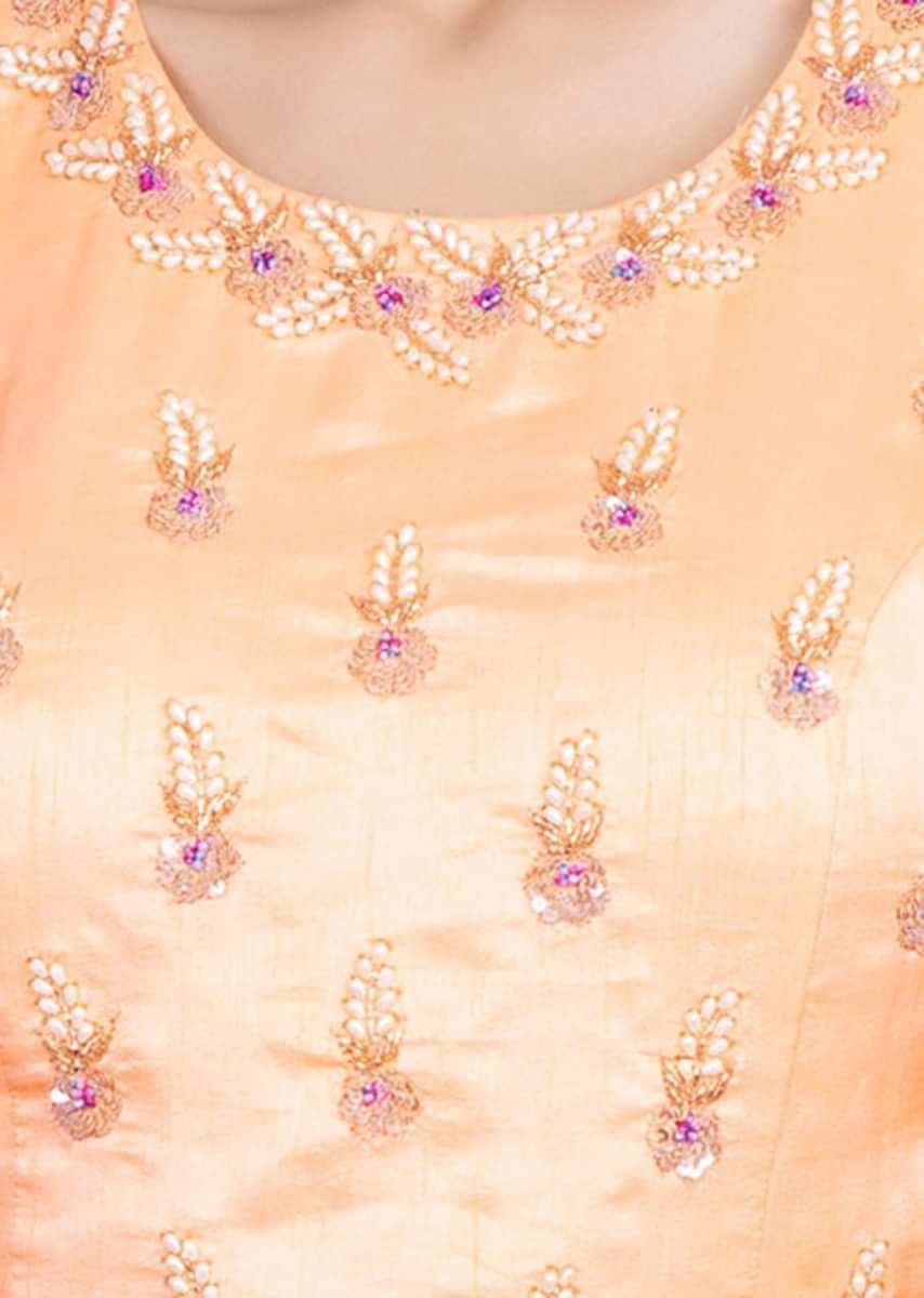 Creamish Peach Blouse With Embroidery Work Paired With Shaded Lehenga Online - Kalki Fashion