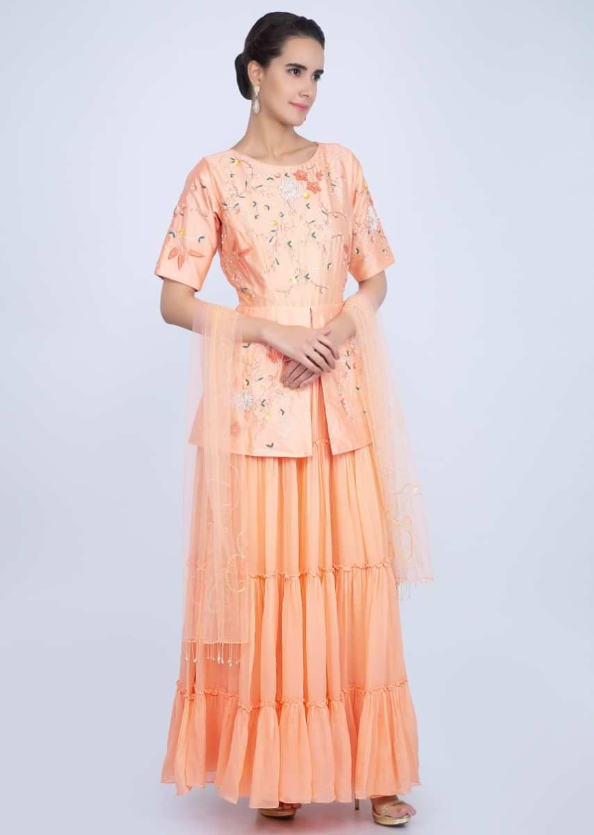 Creamish peach fancy suit with peplum style embroidered bodice only on Kalki