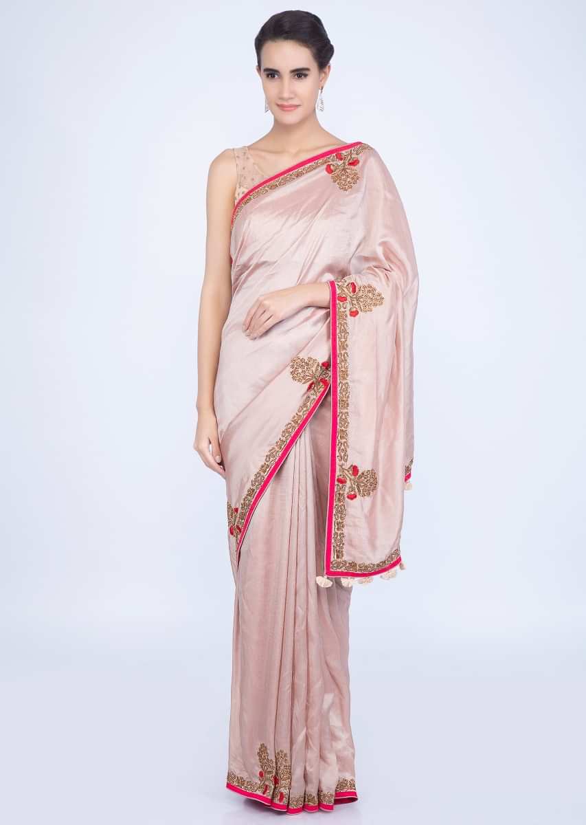 Creamish peach silk saree with contrasting red embroidered border only on Kalki