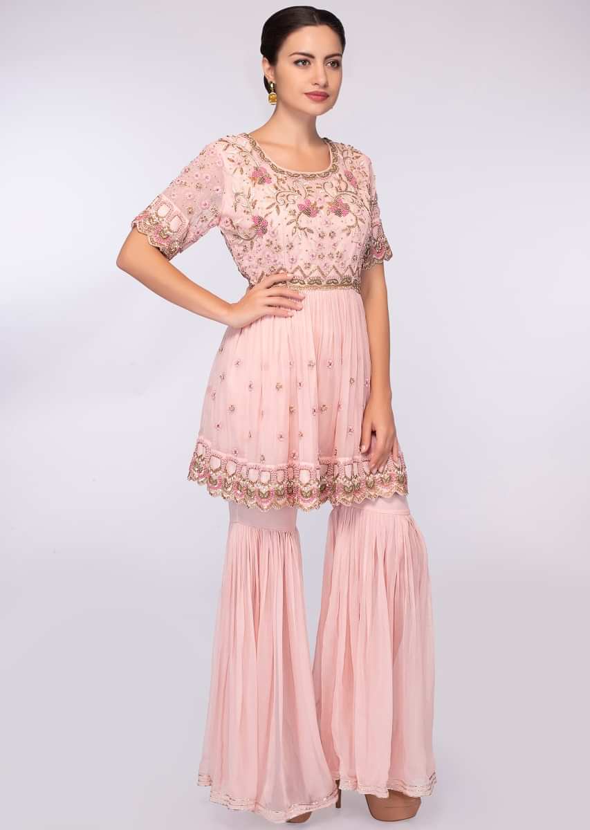 Crepe pink georgette sharara paired with matching embroidered suit