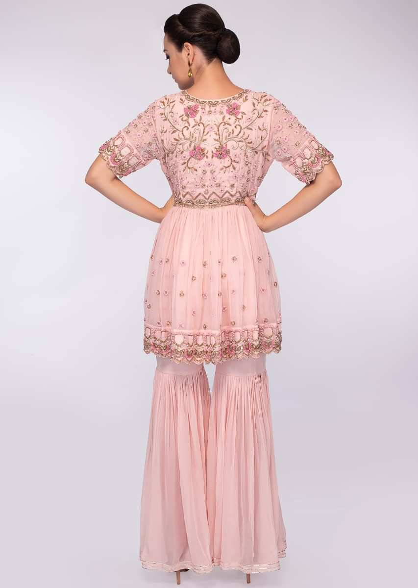 Crepe pink georgette sharara paired with matching embroidered suit