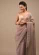 Orchid Haze Glass Tissue Saree With Zardozi Embroidery And Floral Buttis