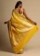Amber Yellow Banarasi Saree In Pure Handloom Silk With Woven Floral Jaal And Chevron Border Along With Unstitched Blouse Piece