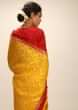 Amber Yellow Saree In Silk With Lurex Woven Chevron Design And Red Bandhani Border Along With Unstitched Blouse  