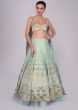 Aqua blue raw silk lehenga set with Greek inspired cowl drape at the back of the blouse only on Kalki