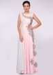 Baby pink lycra net gown with one side embroidery and one side drape 