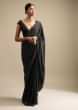 Black Saree In Satin With A Heavy Embellished Pallu Using Scattered Sequins And Unstitched Blouse  