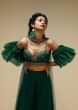 Bottle Green Palazzo Suit With A Cold Shoulder Crop Top Featuring Short Bell Sleeves And Multi Colored Hand Embroidery  