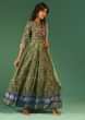 Bottle Green Anarkali Suit In Raw Silk With Patola Print And Kundan Detailing Along With A Yellow Net Dupatta  