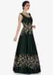 Bottle green raw silk gown with flower embroidery only on Kalki 