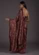 Brick Red Saree In Satin With Floral Print And A Contrasting Cream Sequins Blouse  