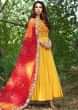 Bright yellow anarkali suit with embroidered bodice and bandhani dupatta 