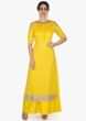 Bright yellow straight palazzo suit embellished in zari butti and border only on Kalki