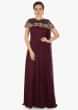 Burgundy drape gown with fancy cape embellished in zardosi and moti work only on Kalki