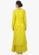 Butter yellow kurti paired with palazzo and yellow organza silk net dupatta only on kalki