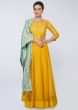 Canary yellow  silk anarkali gown paired with mint green  cotton dupatta in lace embroidery 