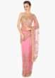 Candy pink saree in net adorn in 3D flower and cut dana jaal embroidery only on Kalki