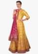 Chrome yellow anarkali suit matched with rani pink brocade dupatta only on Kalki