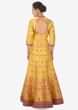Chrome yellow anarkali suit matched with rani pink brocade dupatta only on Kalki