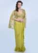 Citrus Green Frill Draped Skirt With Embroidered Blouse And Cape Style Net Jacket Online - Kalki Fashion