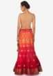 Coral and orange shaded lehenga in silk enhanced in weave embroidery only on Kalki