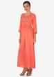 Coral long dress adorn in embroidered butti and gathers only on Kalki