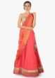 Coral pink lehenga with embroidered border and peach contrast dupatta only on Kalki