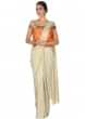 Cream foil saree gown with orange brocade bodice only on Kalki