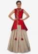 Cream lehenga matched with red jacket blouse adorn in french knot embroidery only on Kalki