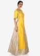 Cream lehenga with long yellow embroidered top only on Kalki