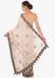 Cream peach saree in silk with gotta patch and resham embroidered butti only on Kalki