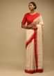 Cream Saree In Silk With Lurex Woven Chevron Design And Red Bandhani Border Along With Unstitched Blouse  
