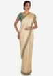 Cream Saree With Dark Green Blouse Crafted In Moti And Cut Dana Embroidery Work Online - Kalki Fashion