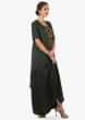 Crepe silk dark green dress enhanced with pleats and a jacket
