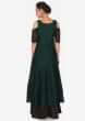 Black anarkali suit matched with dark green top layer adorn in cut dana and zardosi only on Kalki