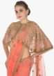 Dark peach net saree paired with a net embroidered cape