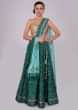 Emerald green silk lehenga with patola print and embroidery 