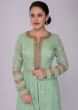 Floral green sharara suit set in self thread embroidered jaal work