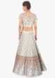 Floral resham embroidered blue lehenga set paired with pink net dupatta