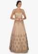 Golden lehenga with a cape enhanced in heavy sequin embroidery work only on Kalki