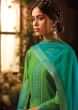 Green cotton silk unstitched suit paired with floral weaved bottoms and chiffon dupatta with brocade border