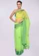 Green organza saree in resham and french knot embroidered butti 