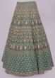 Green raw silk lehenga set in temple and geometric embroidery 