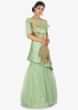 Green strapless satin net gown  along with a fancy wrap around 