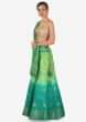 Green and turq shaded lehenga in silk enhanced in weave embroidery only on Kalki