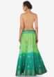 Green and turq shaded lehenga in silk enhanced in weave embroidery only on Kalki