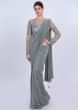 Grey shimmer lycra saree with matching net embroidered blouse only on Kalki