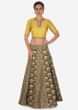 Grey lehenga in brocade silk with yellow raw silk embroidered blouse only on Kalki