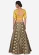 Grey lehenga in brocade silk with yellow raw silk embroidered blouse only on Kalki
